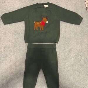 Green knitter sweater outfit with reindeer